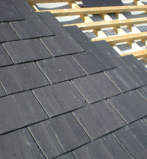 Part way through a slate roof in Salford